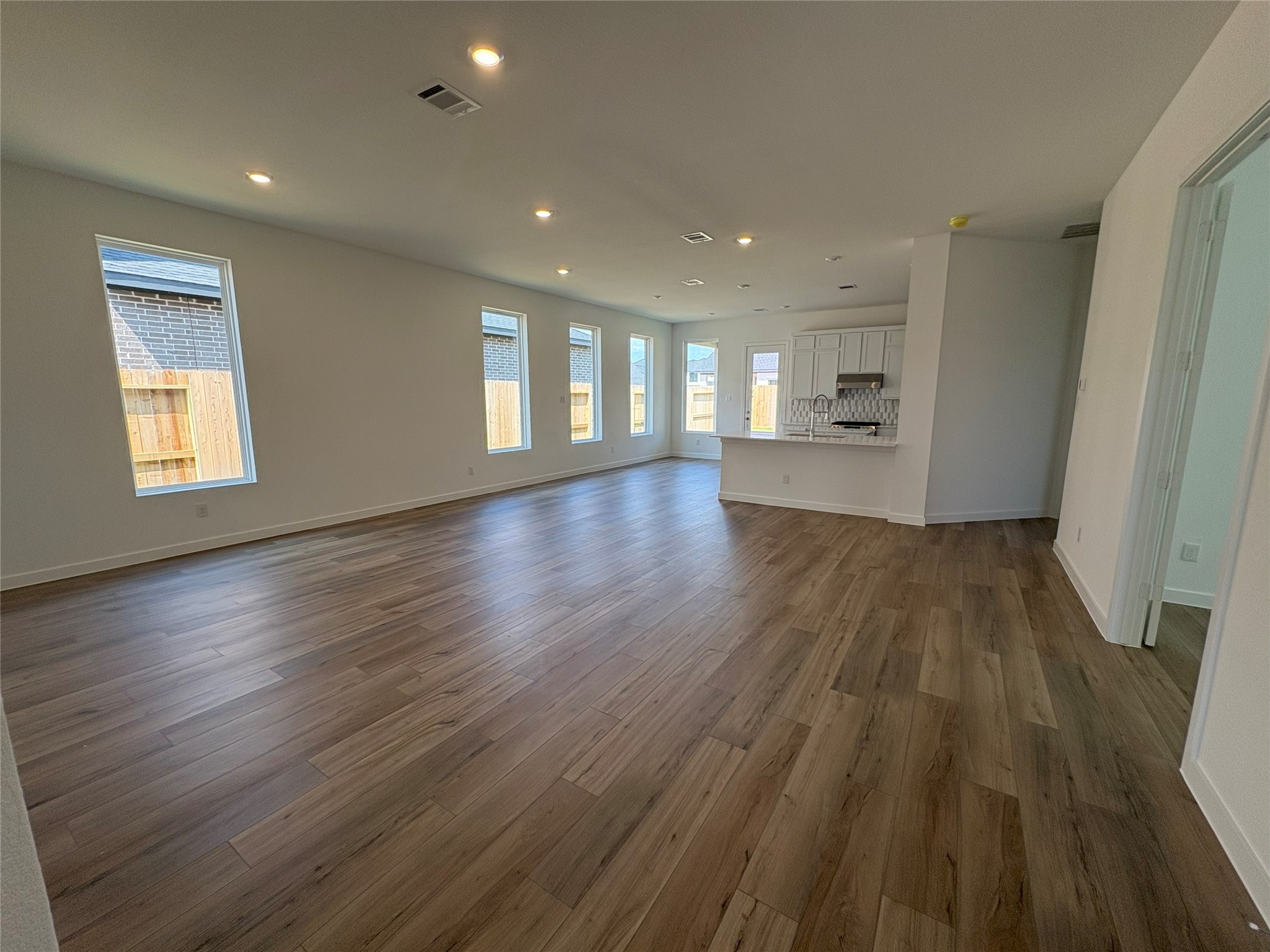 4227 Eagle Pass Drive Rosenberg, TX 77469 - Photo 5 of 15 a view of empty room with wooden floor and window
