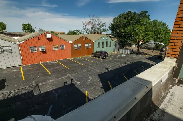 a view of a street with an outdoor space