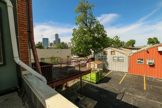 a view of a balcony with chairs