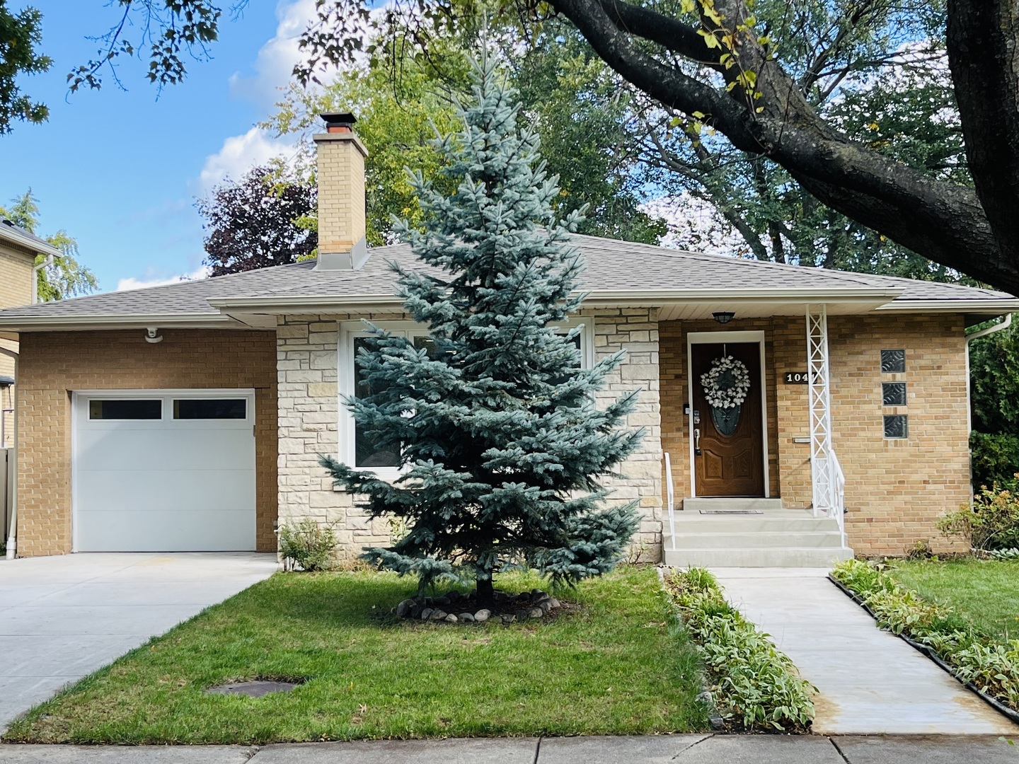 front view of a house with a yard