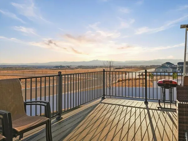 a view of wooden balcony with city view