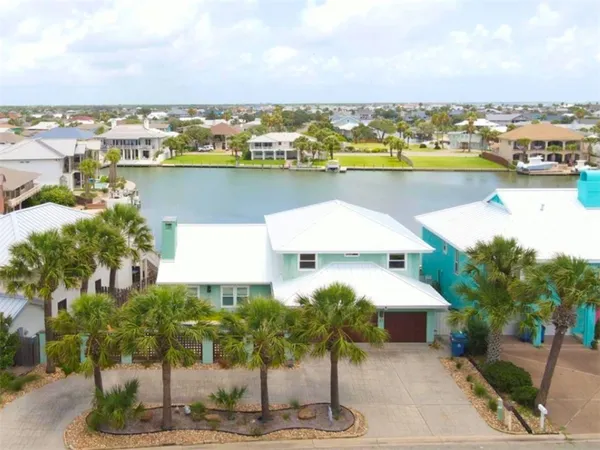 a aerial view of a house with a lake view