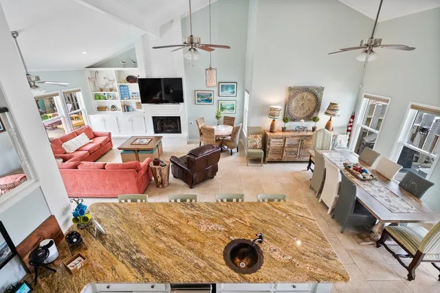 a bedroom with bed and a chandelier