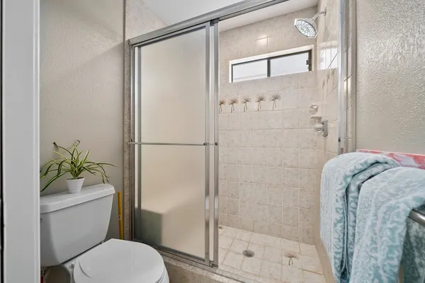 a bedroom with bed and window