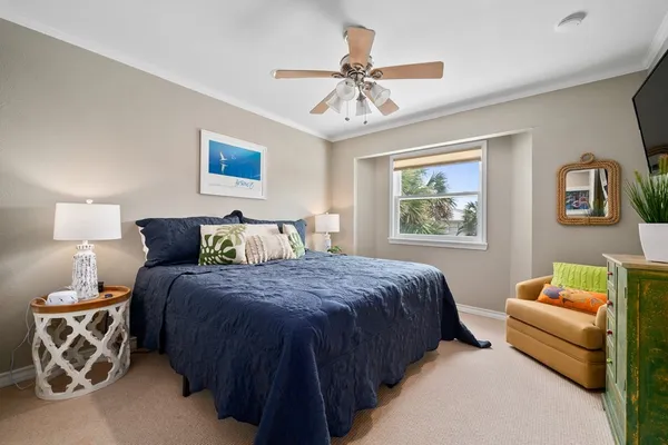 a bedroom with double bed and a window