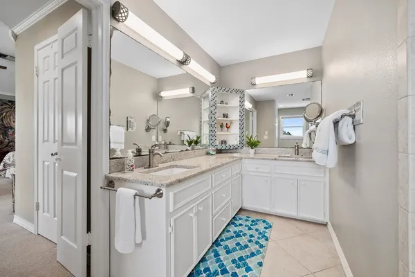 a bathroom with a bathtub and a window