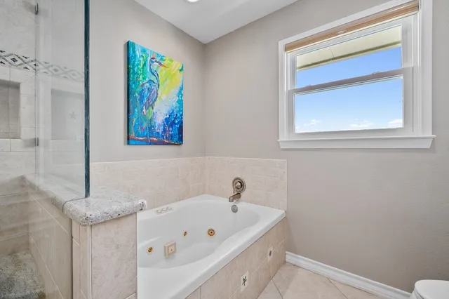 a view of bathroom with a washer and dryer