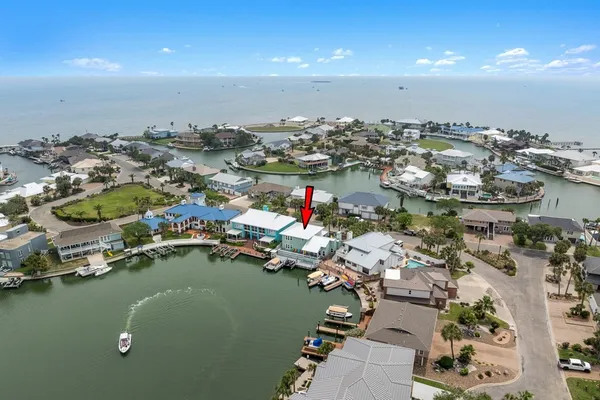 an aerial view of a house with a lake view
