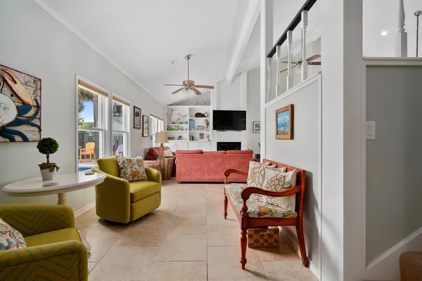 a living room with furniture fireplace and flat screen tv