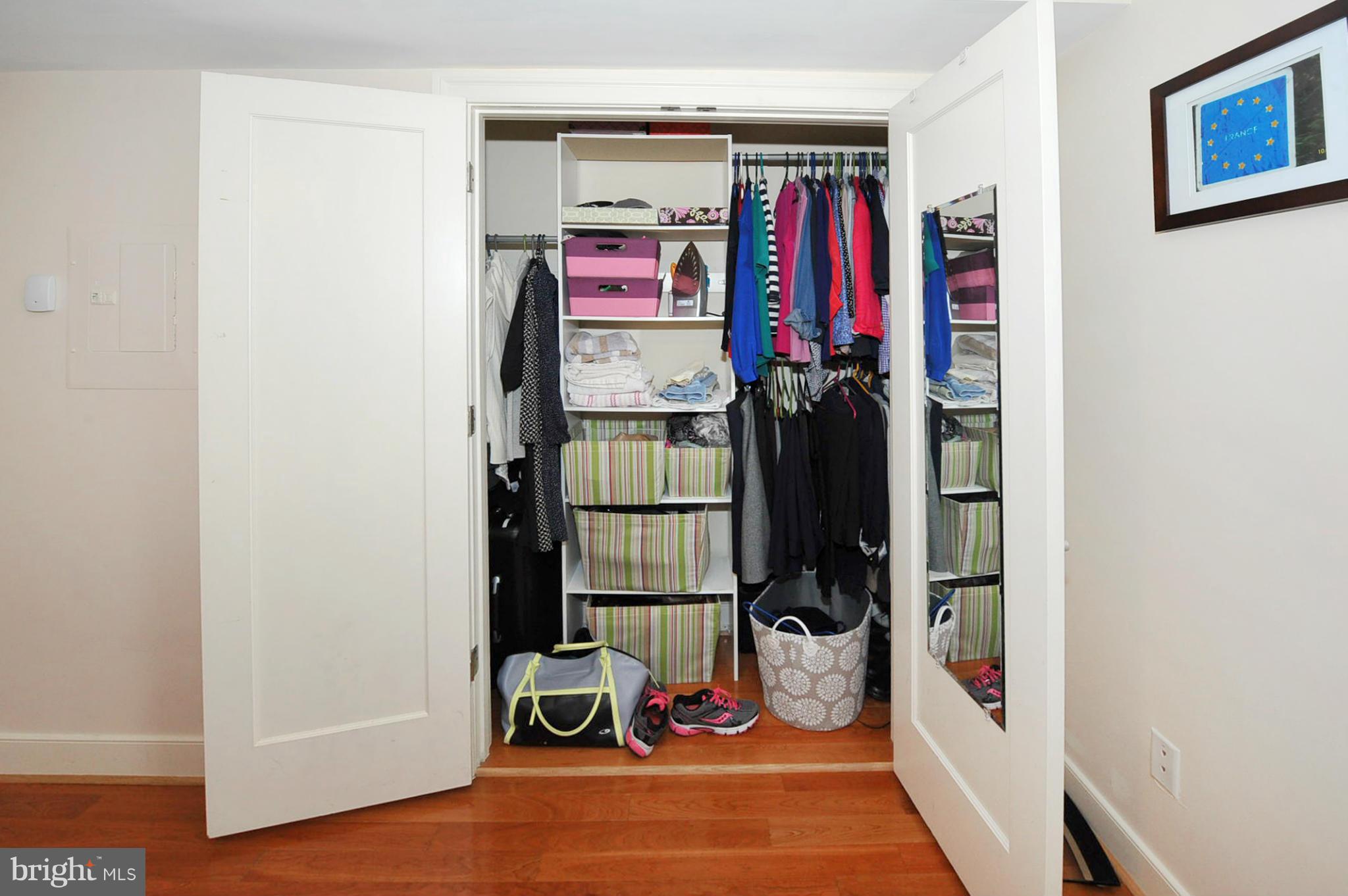 1400 Longfellow Street Northwest, Unit 101 Washington, DC 20011 - Photo 12 of 14 a view of walk in closet with clothes and shoes