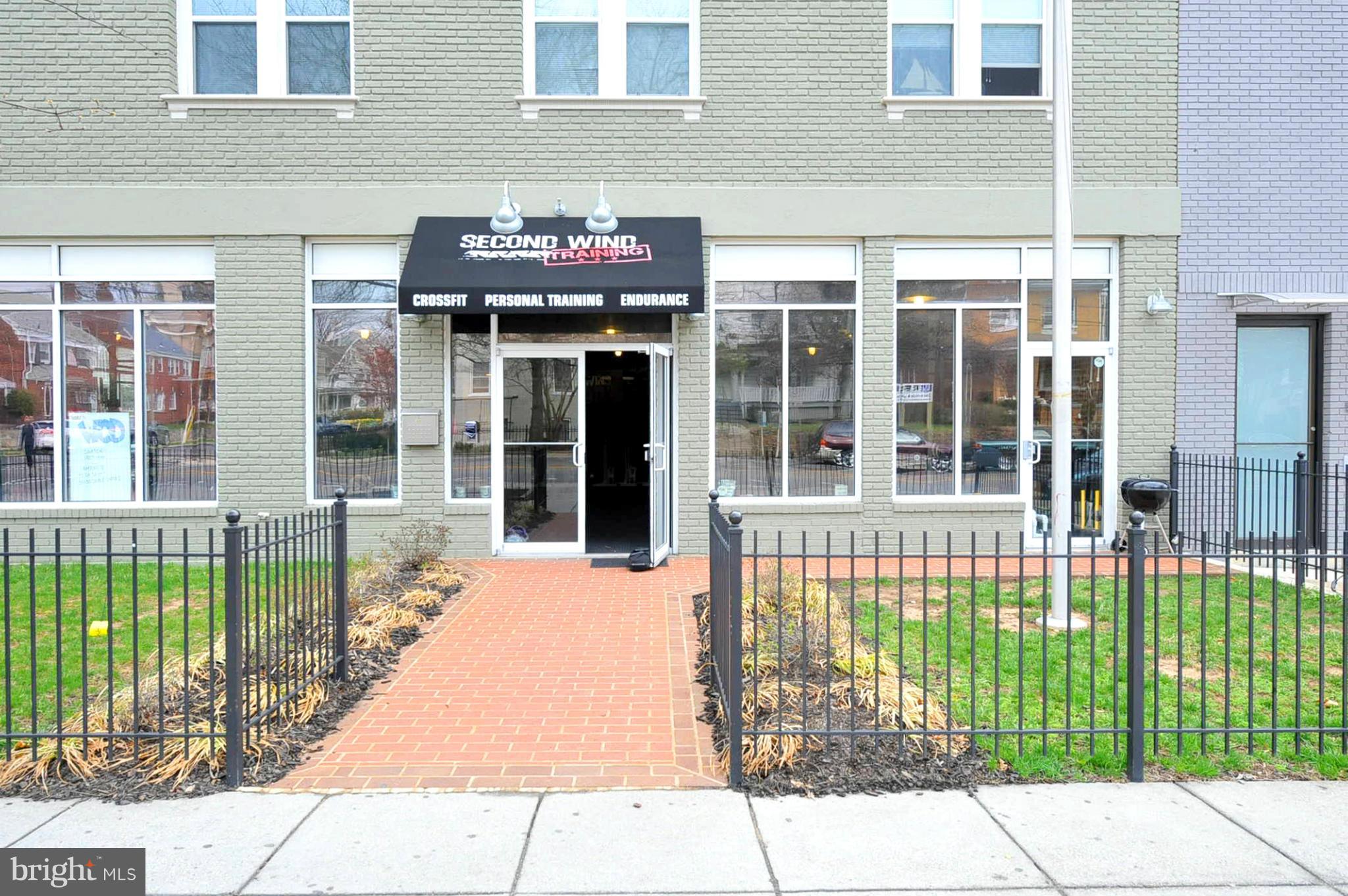 1400 Longfellow Street Northwest, Unit 101 Washington, DC 20011 - Photo 14 of 14 a front view of a building with a garden