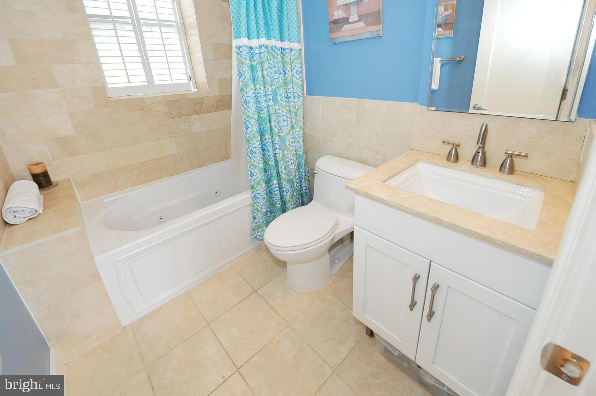 1400 Longfellow Street Northwest, Unit 101 Washington, DC 20011 - Photo 10 of 14 a bathroom with a sink toilet and shower