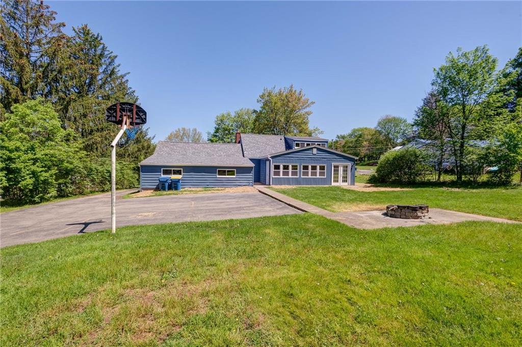 954 Old Princeton Road New Castle, PA 16101 - Photo 23 of 24 a view of a house with a big yard and large trees