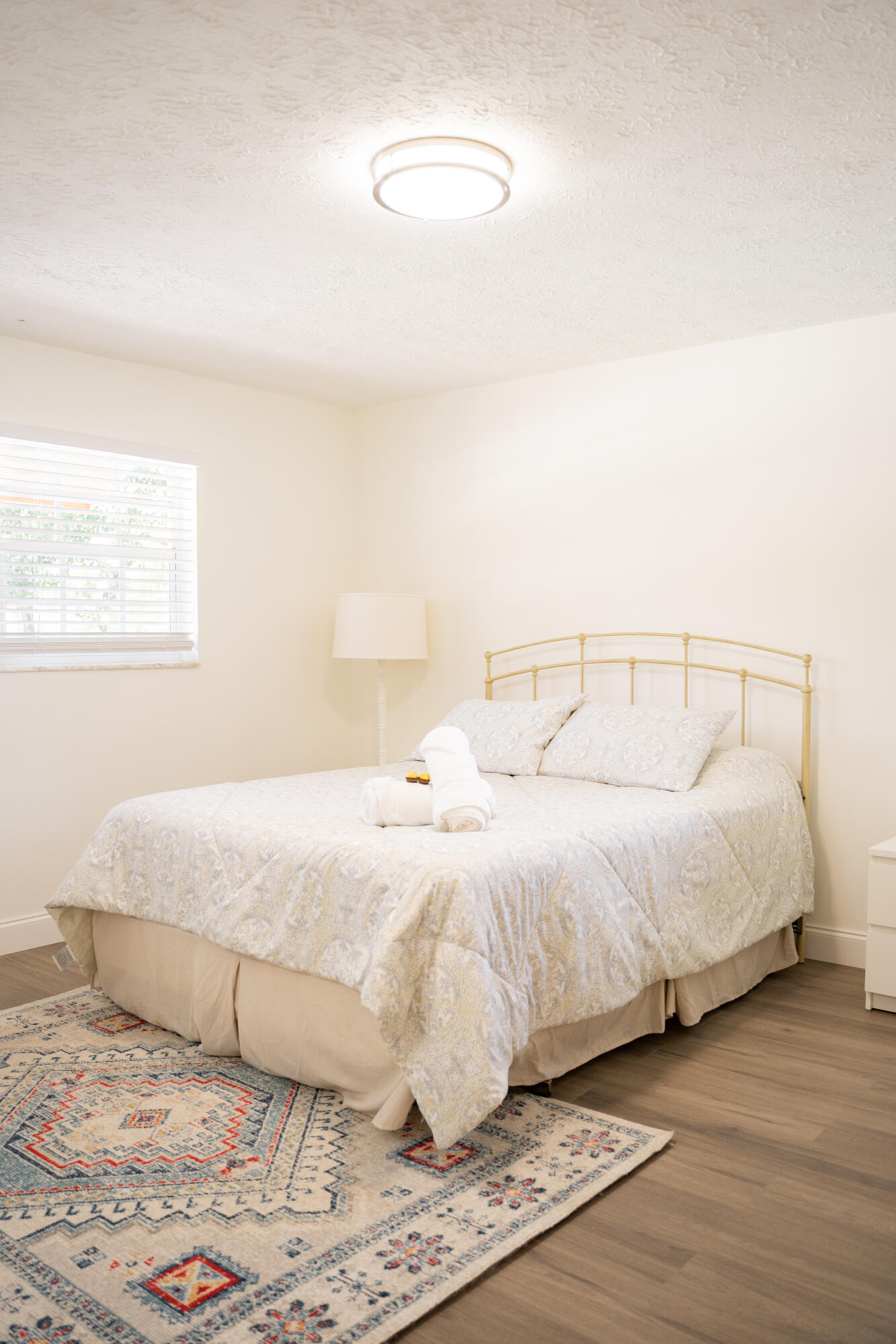 1425 Riverside Circle Wellington, FL 33414 - Photo 14 of 35 a bedroom with a bed and a night stand