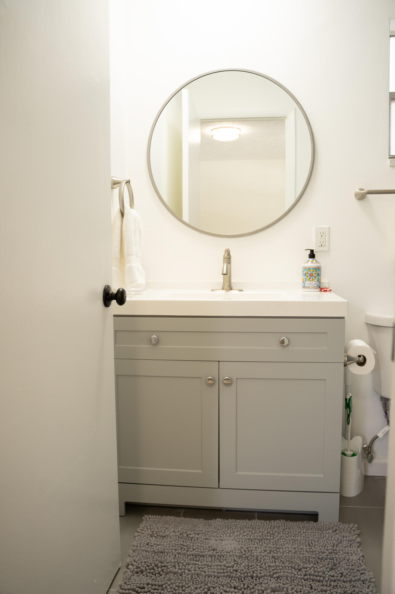 1425 Riverside Circle Wellington, FL 33414 - Photo 16 of 35 a bathroom with a sink and a mirror
