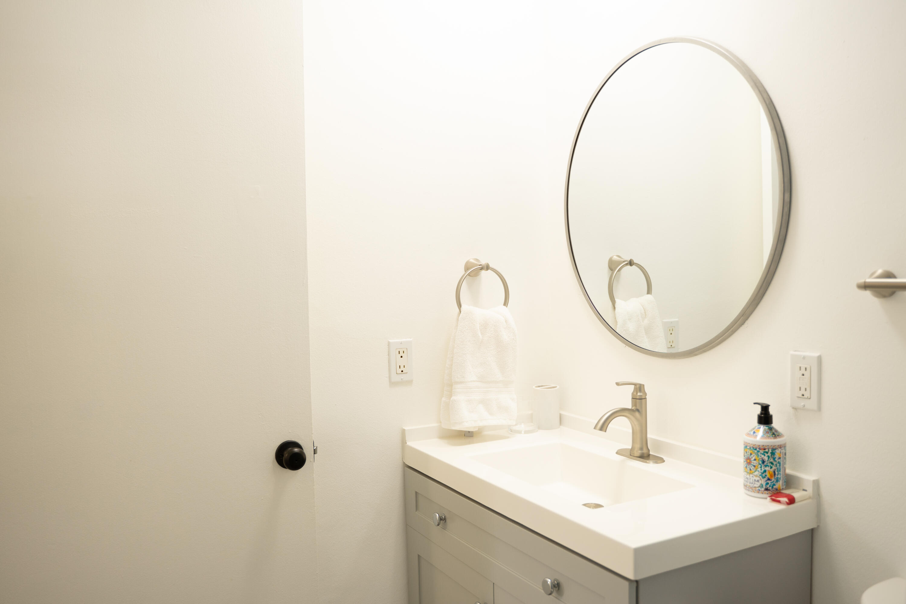 1425 Riverside Circle Wellington, FL 33414 - Photo 17 of 35 a bathroom with a sink and a mirror