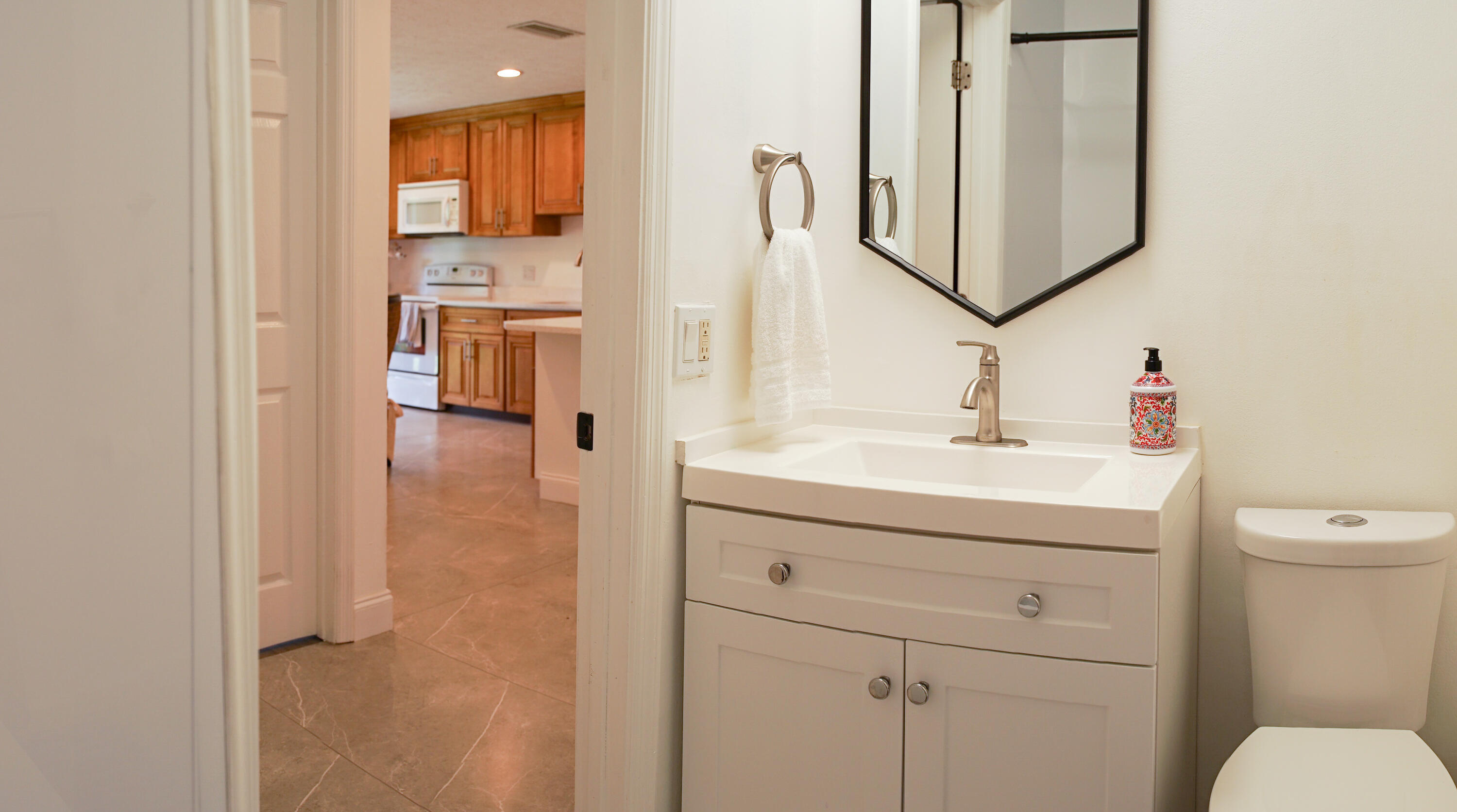 1425 Riverside Circle Wellington, FL 33414 - Photo 24 of 35 a bathroom with a sink vanity and mirror