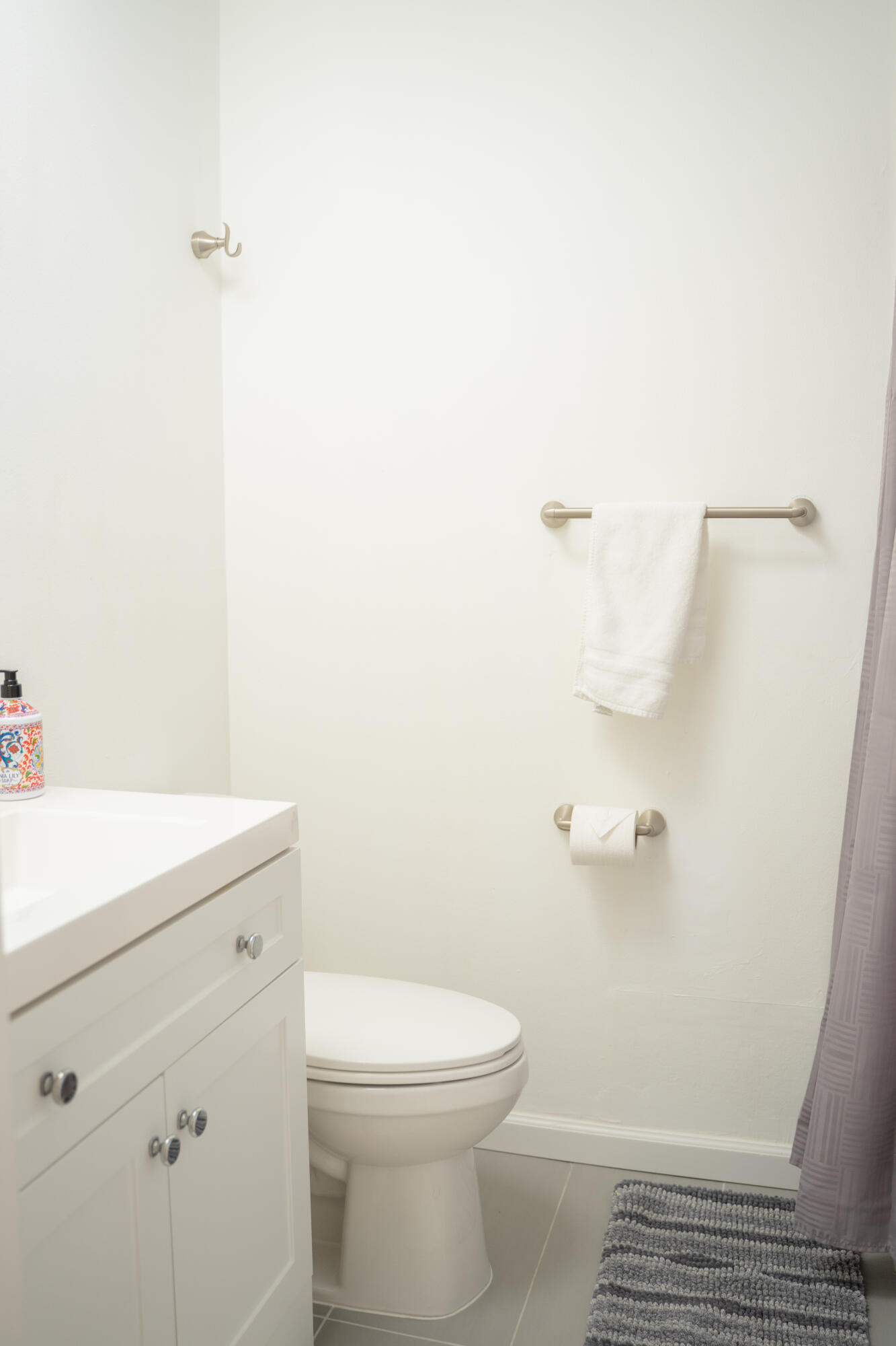1425 Riverside Circle Wellington, FL 33414 - Photo 26 of 35 a bathroom with a sink a toilet and a shower