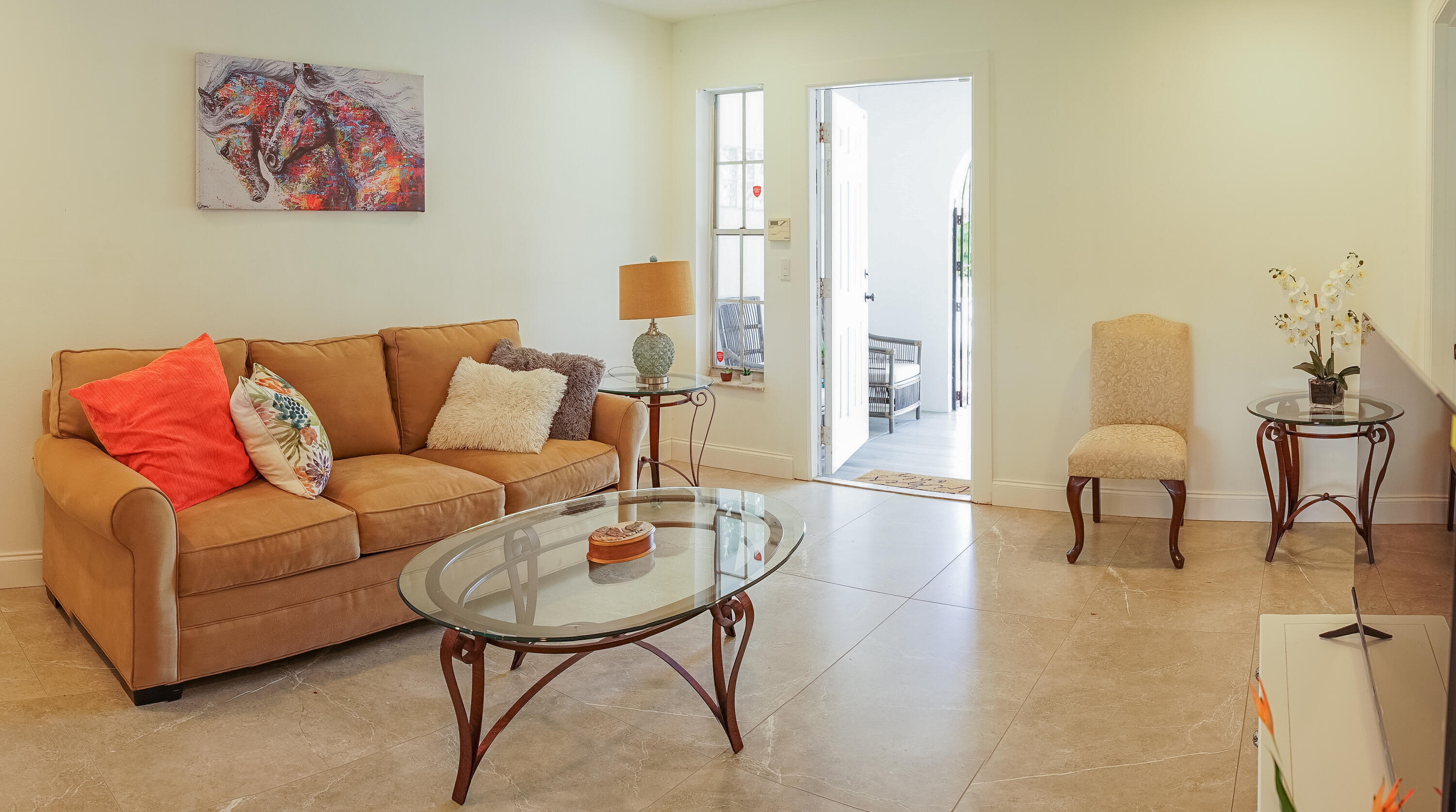 1425 Riverside Circle Wellington, FL 33414 - Photo 31 of 35 a living room with furniture and a lamp
