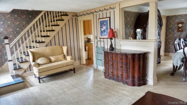 a living room with furniture and a rug