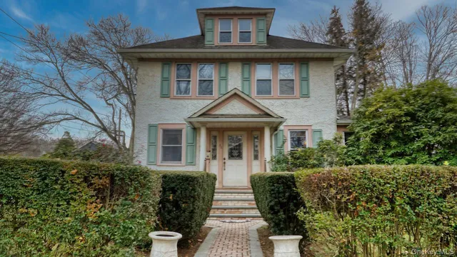 a front view of a house with yard