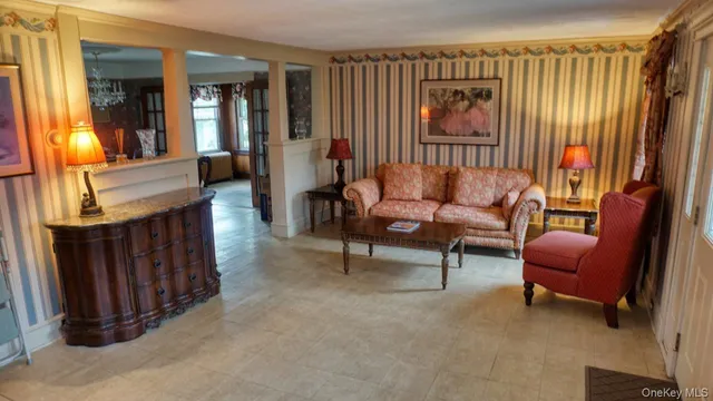 a living room with furniture and a window