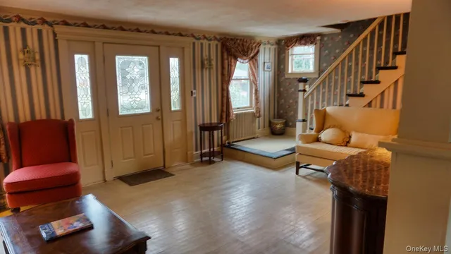 a living room with furniture and a window