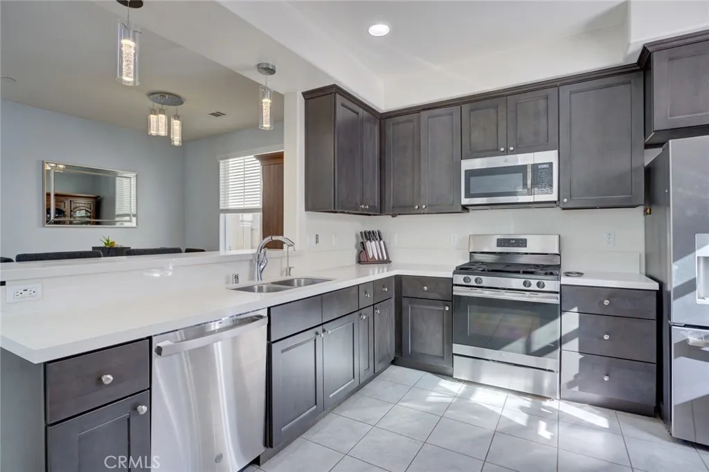 1913 Celebration Avenue Santa Maria, CA 93454 - Photo 13 of 35 a kitchen with a sink stove and microwave