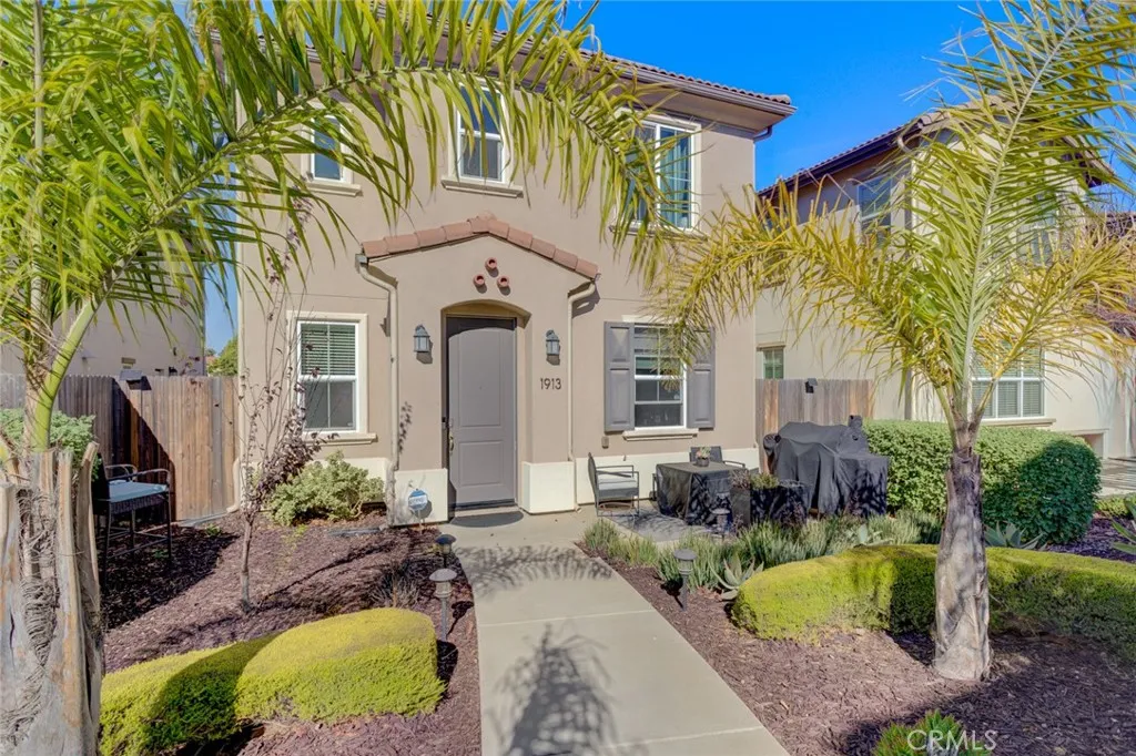 1913 Celebration Avenue Santa Maria, CA 93454 - Photo 3 of 35 a front view of a house with a yard