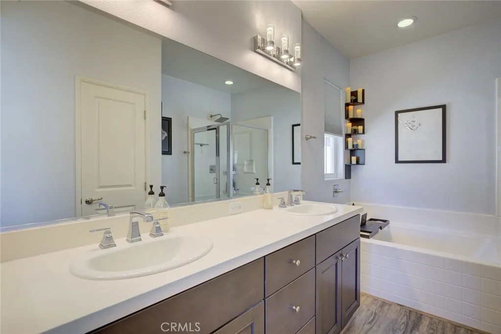 1913 Celebration Avenue Santa Maria, CA 93454 - Photo 31 of 35 a bathroom with a sink double vanity granite tub and a mirror