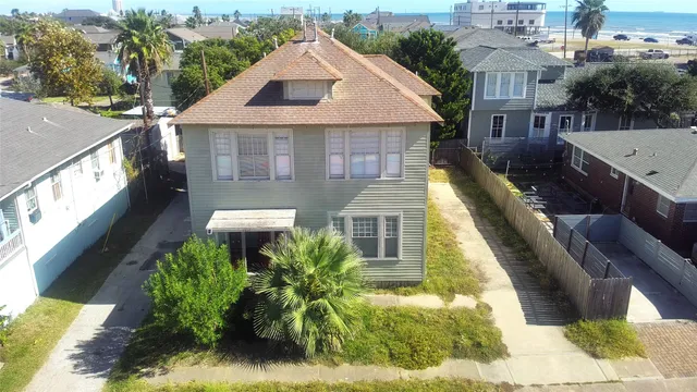 a aerial view of a house with a yard