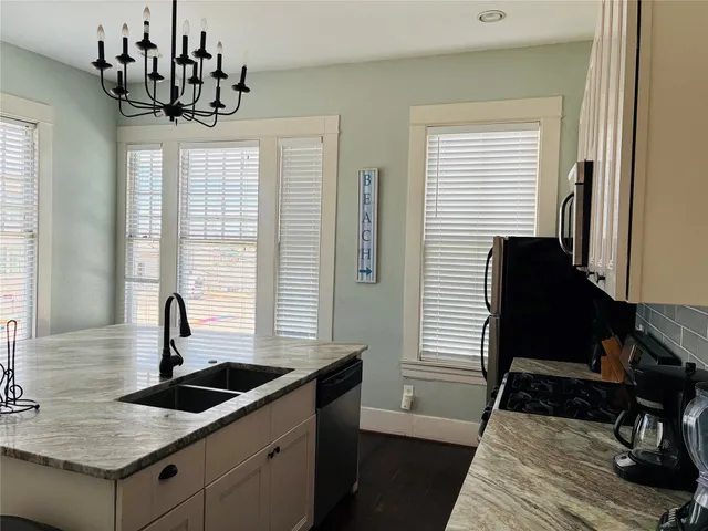 a kitchen with a sink and cabinets