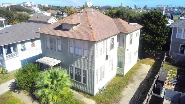 a aerial view of a house with a yard