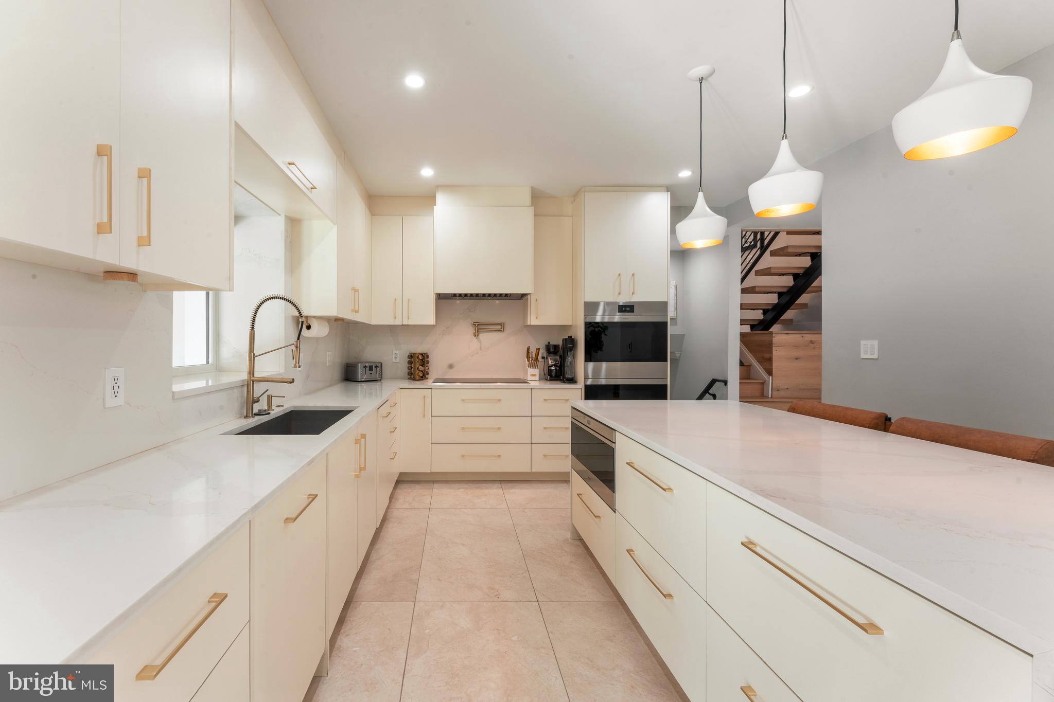 528 Hoyt Road Huntingdon Valley, PA 19006 - Photo 12 of 56 a large kitchen with stainless steel appliances kitchen island a large island in the center