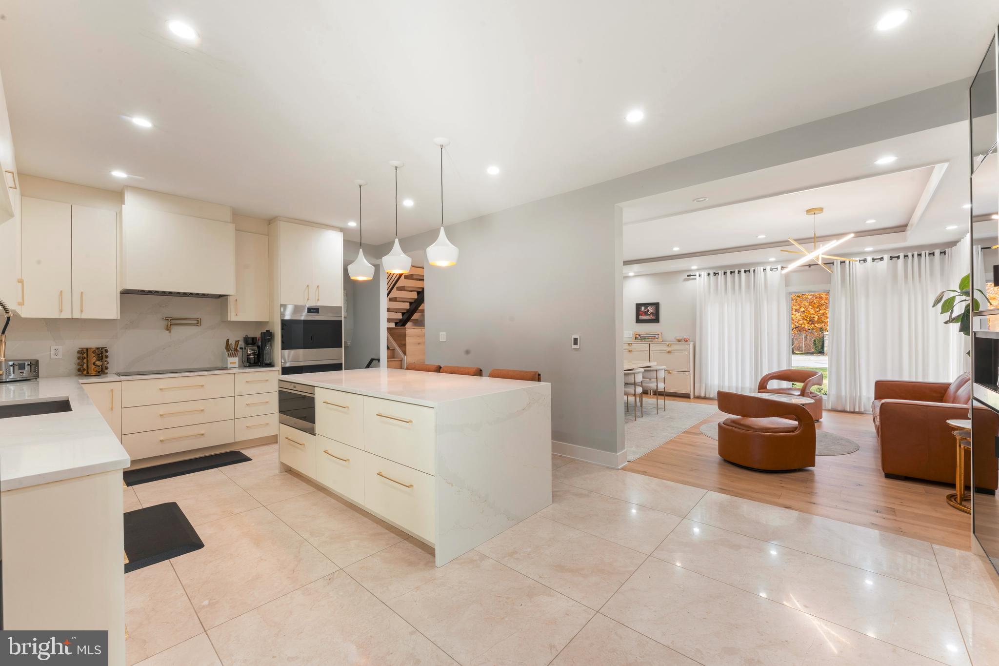 528 Hoyt Road Huntingdon Valley, PA 19006 - Photo 10 of 56 a large white kitchen with white cabinets and stainless steel appliances