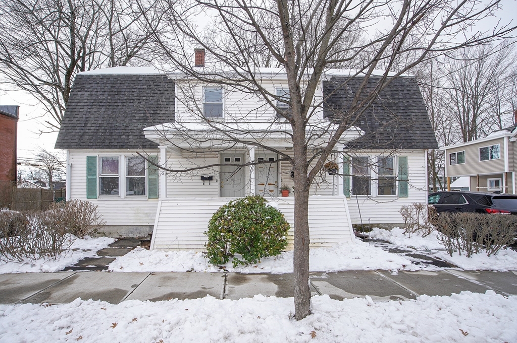 42 Montgomery Street, Unit 42 Westfield, MA 01085 - Photo 1 of 14 a front view of a house with a yard and garage