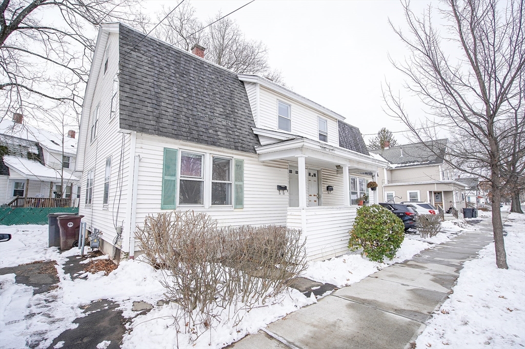 42 Montgomery Street, Unit 42 Westfield, MA 01085 - Photo 14 of 14 a view of a house with a yard covered in snow