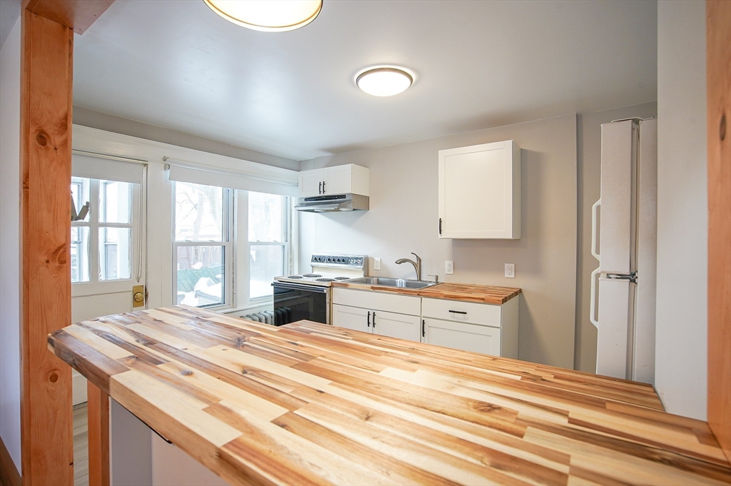 42 Montgomery Street, Unit 42 Westfield, MA 01085 - Photo 8 of 14 a spacious bathroom with a sink and a large mirror