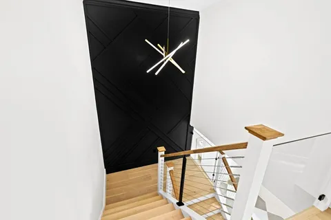 a bathroom with a double vanity sink a mirror a bathtub and shower