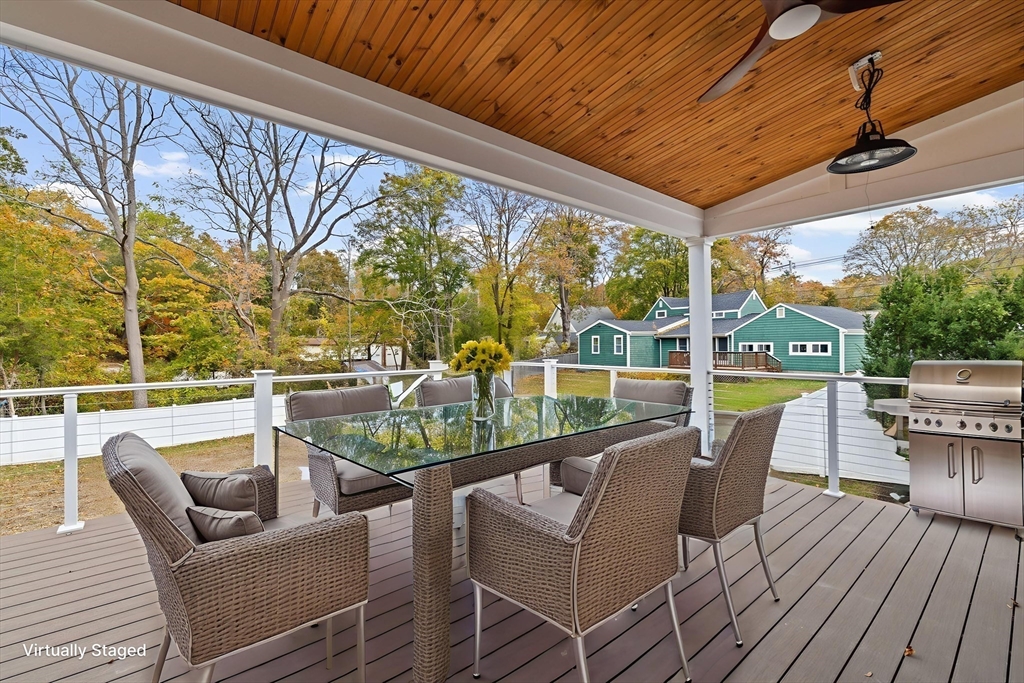 7 Lewis Court Hingham, MA 02043 - Photo 33 of 42 a view of a patio with couches chairs dining table and chairs with wooden floor
