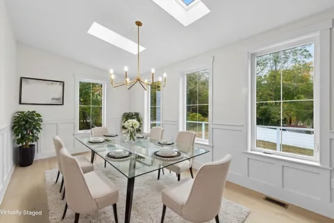 an empty room with windows and outdoor view