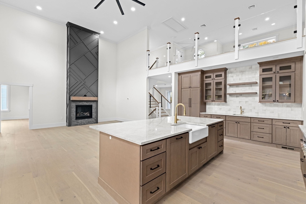 7 Lewis Court Hingham, MA 02043 - Photo 9 of 42 a kitchen with a sink stove and cabinets