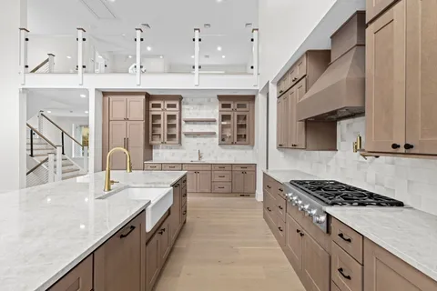 a kitchen with cabinets and window