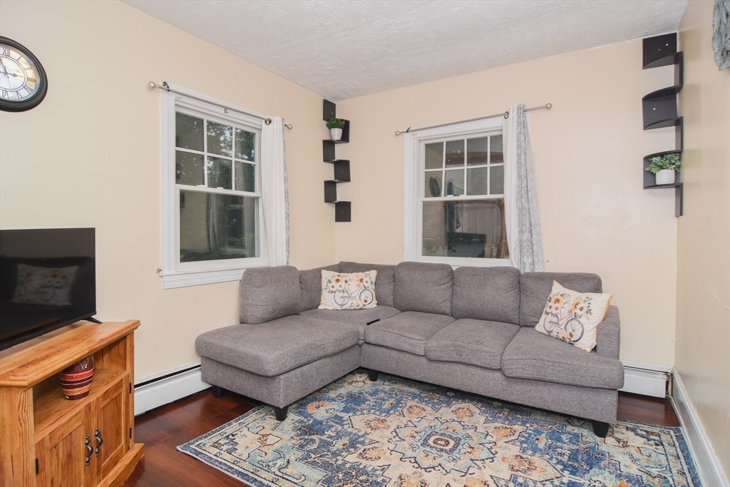 9 Topping Road Andover, MA 01810 - Photo 12 of 41 a living room with furniture and a flat screen tv