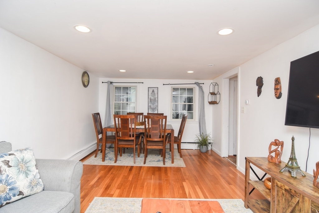 9 Topping Road Andover, MA 01810 - Photo 15 of 41 a dining room with furniture and wooden floor