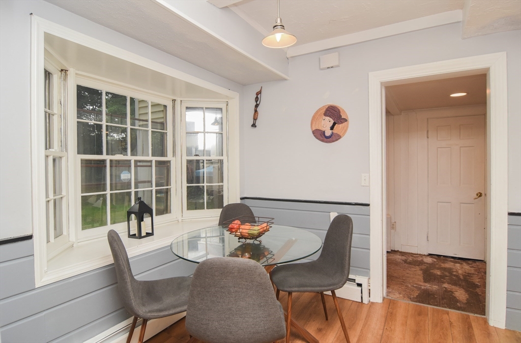 9 Topping Road Andover, MA 01810 - Photo 19 of 41 a view of a dining room with furniture window and wooden floor