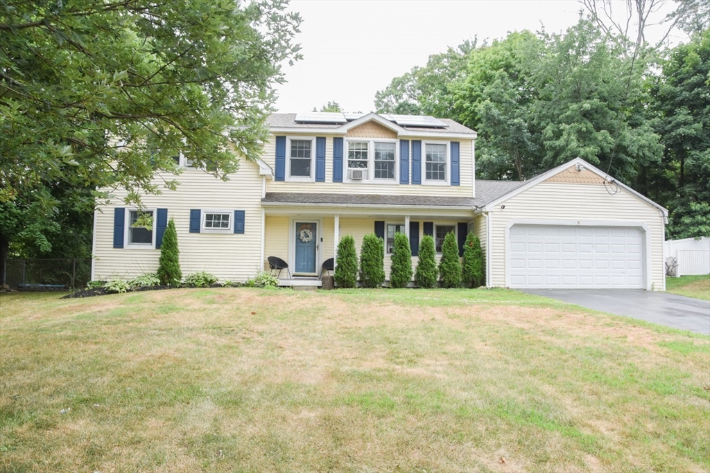 9 Topping Road Andover, MA 01810 - Photo 2 of 41 a front view of a house with a yard and garage