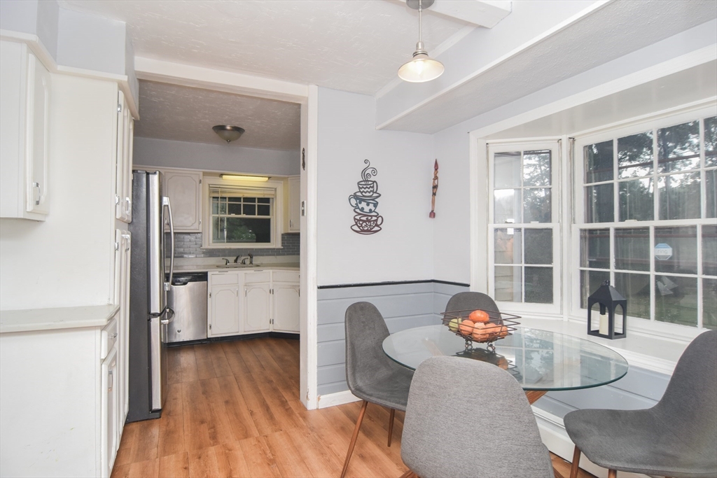9 Topping Road Andover, MA 01810 - Photo 22 of 41 a living room with furniture a flat screen tv and a table