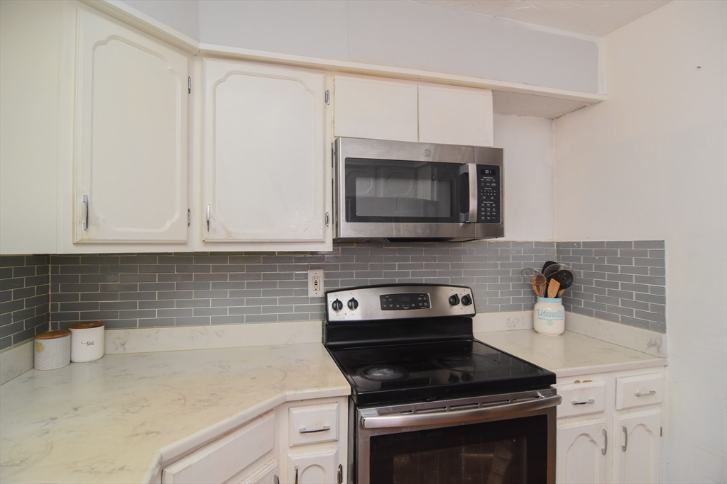 9 Topping Road Andover, MA 01810 - Photo 23 of 41 a kitchen with appliances a sink and cabinets