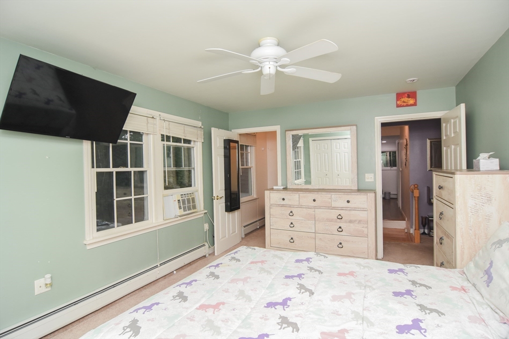 9 Topping Road Andover, MA 01810 - Photo 24 of 41 a bedroom with a bed and a flat screen tv